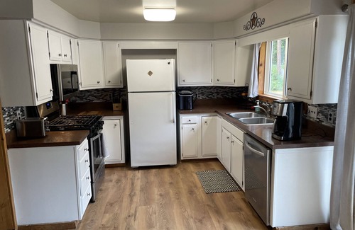 Lake Ann House | Charming Home in Lake Ann Village - Pet-Friendly Retreat!