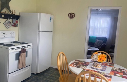Norris Point Cottage | Charming Retreat with Breathtaking Views & Family Amenities