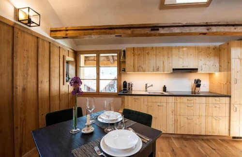 Brienz House | Inviting Village Center Retreat for Families and Friends