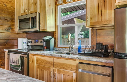 Champion Cabin | Inviting Log Cabin Retreat with Hot Tub & Spa Amenities