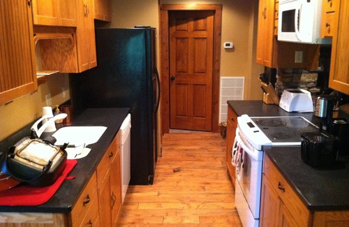 Tuckasegee Cabin | Inviting Lakefront Cabin on Wolf Lake with Hot Tub & Kayaks