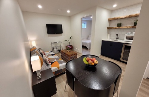 Southeast Calgary House | Cozy new unit near restaurants, bars, stores, bus stations, and hospital.