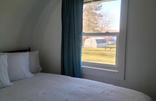 Paw Paw House | Charming Quonset Hut Retreat on Scenic Maple Lake