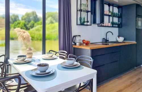 Mielno Boat Rental | Stylish Houseboat Retreat with Lake Jamno Views