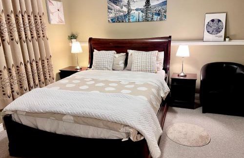Southwest Calgary House | Renovated Walkout Suite with King Bed and Kitchen