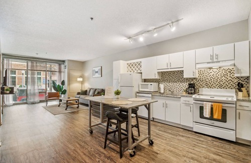 Mill District Apartment | Inviting CozySuites Mill District: Pool, Gym & Pet Friendly