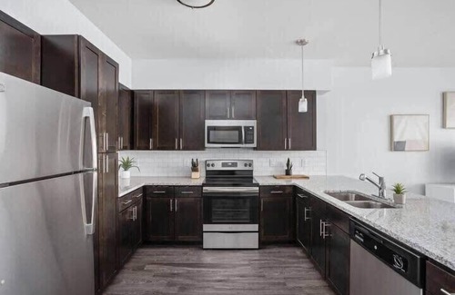 Indianapolis Apartment | Inviting CozySuites 4BR with Pool Near Whole Foods