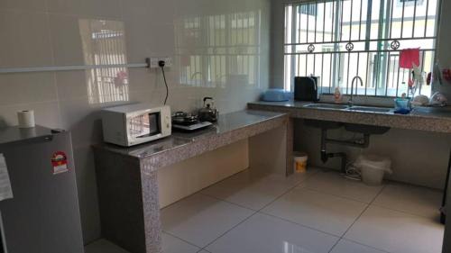 Bintulu House | Cozy Child-Friendly Retreat at Cozzy26 Homestay
