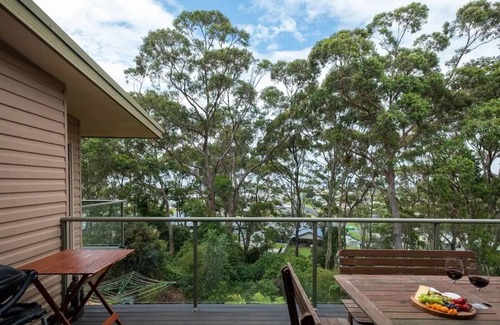 Tomakin House | Inviting Three-Level Retreat with Breathtaking Sea Views