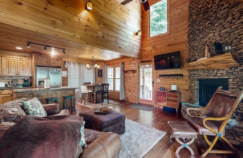Cherry Log Cabin | Creek Cabin with fenced yard, screened in patio and hot tub
