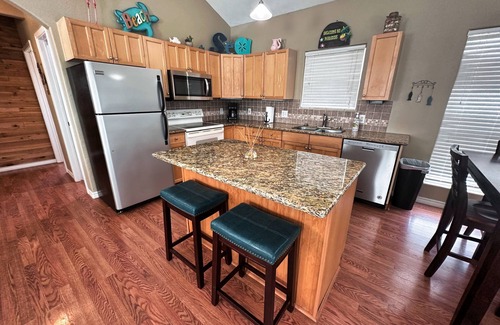 Cedar Lane House | Creekside Getaway: Ideal for Fishing and Family Fun