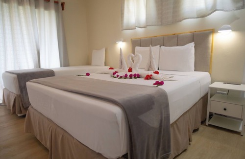 Bon Accord Village Hotel | Beachfront Bliss at Crown Point Beach Hotel with Pool