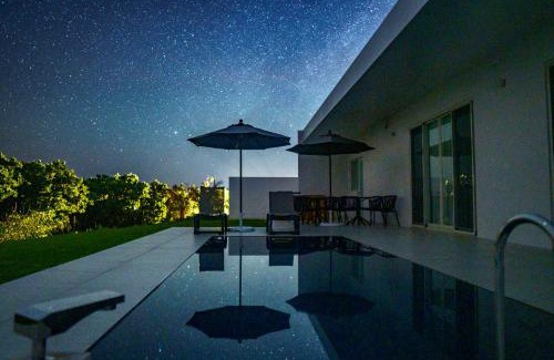 Ueno Villa | Elegant Crystal Villa Bayside: Oceanfront Retreat Awaits