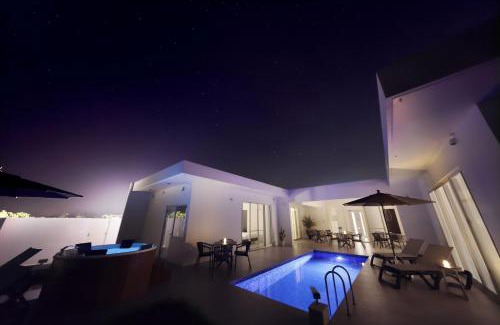 Ueno Villa | Elegant Crystal Villa Bayside: Oceanfront Retreat Awaits