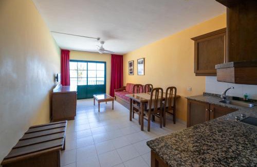 Playa de la Calera Apartment | Idyllic Complejo Las Tres Palmeras with Oceanfront Pool
