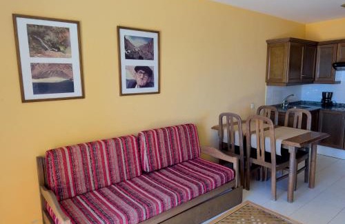 Playa de la Calera Apartment | Idyllic Complejo Las Tres Palmeras with Oceanfront Pool