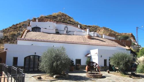 Cortes y Graena Apartment | Discover Cuevas La Cocinillas: Pet-Friendly Retreat with Pool