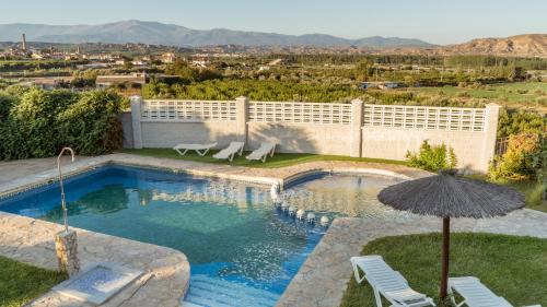 Benalua de Guadix Apartment | Discover Cuevas La Granja: 4-Star Oceanfront Retreat