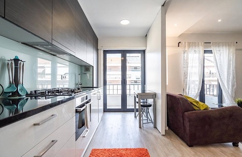 Sao Jorge de Arroios Apartment | Cozy Curl Apartment with Wi-Fi, Balcony & Garage Access