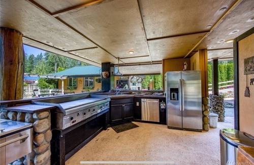 West Hills House | Scenic Lake-Front Log Cabin Estate with Pool & Mountain Views
