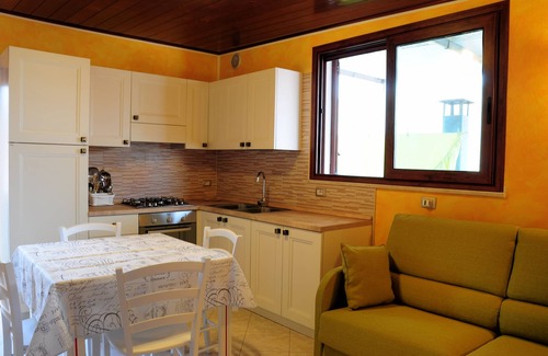 Province of Cagliari Apartment | Charming Central Apartment with Ocean View & Spa Access