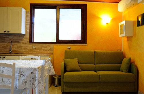 Province of Cagliari Apartment | Charming Central Apartment with Ocean View & Spa Access