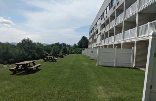Weirs Beach Apartment | Inviting Cedar Lodge Room with Balcony & Scenic Lake Views