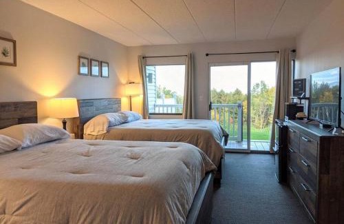 Weirs Beach Apartment | Inviting Cedar Lodge Room with Balcony & Scenic Lake Views