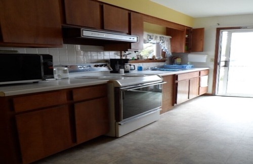 South Butler Cottage | Cute Waterfront Cottage with Large Deck at Turtle Cove Resort