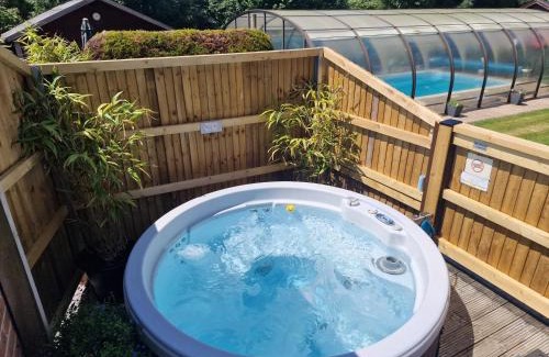 New Forest District House | Relaxing Cypress Log Cabins with Oceanfront Pool Access