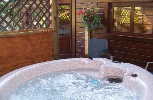New Forest District House | Relaxing Cypress Log Cabins with Oceanfront Pool Access