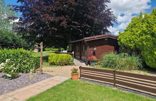 New Forest District House | Relaxing Cypress Log Cabins with Oceanfront Pool Access