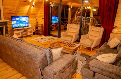 Ardesen Ski Chalet | Relax in a Scenic Bungalow with Hot Tub & Cozy Fireplace