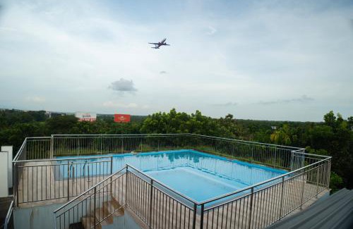 Nedumbassery Hotel | Elegant Daffodils Airport Suites with Pool & High Ratings