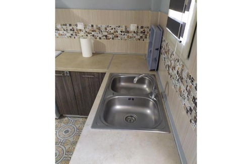 Magoulades Apartment | Discover Dahlia: Family-Friendly, Wheelchair Accessible Stay