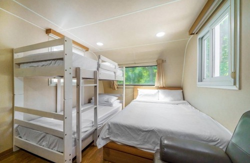 Danyang House | Eco-Friendly Danyang Pine Caravan Camping with Family Amenities