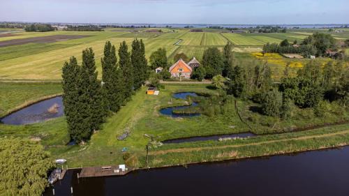Delfstrahuizen Villa | Relax at De Twee Zwanen: 4-Star Stay with Pool & Hot Tub