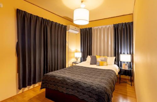 Kadena-cho House | Spacious Deluxe Room at URUMAHOTEL - Family Friendly Stay