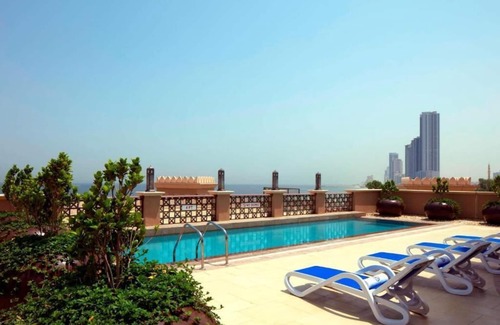 Beach & Coast Apartment | Inviting Room Steps from Al Heera Beach with Pool & Ocean View