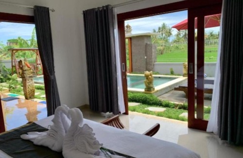 Mambal House | Deluxe Room Puri Uma Dewi room only