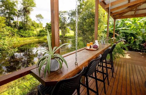 Doonan House | Elegant Suite with Fireplace & Pond in Noosa Hinterland