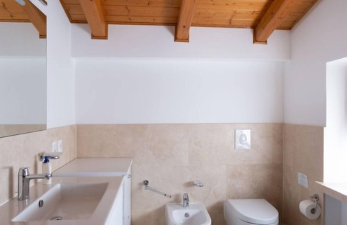 Magugnago Apartment | Experience Delvai by Interhome: Oceanfront Bliss Awaits