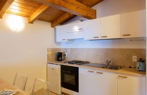 Magugnago Apartment | Experience Delvai by Interhome: Oceanfront Bliss Awaits
