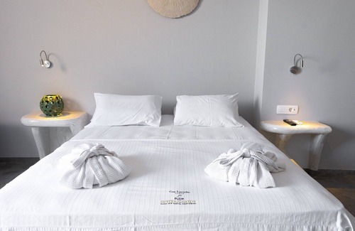 Perivolos Apartment | Explore Demilmar Suites: Oceanfront Bliss in Santorini