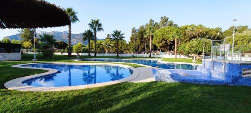 Les Deveses Apartment | Denia Beach Apartment with Private Garden & Pool Access