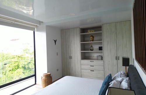 Luis Donaldo Colosio Apartment | Relaxing Stay at Departamento 5th Av - Rooftop Pool & Beach