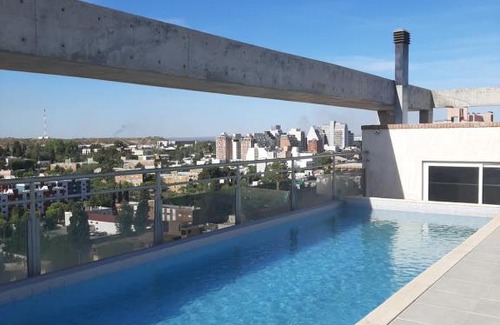 Neuquen Apartment | Relaxing Poolside Retreat: Departamento Amueblado Awaits