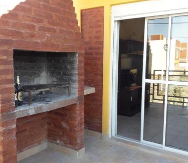 Las Grutas House | Comfortable Departamentos Las Grutas with Breakfast & Fireplace