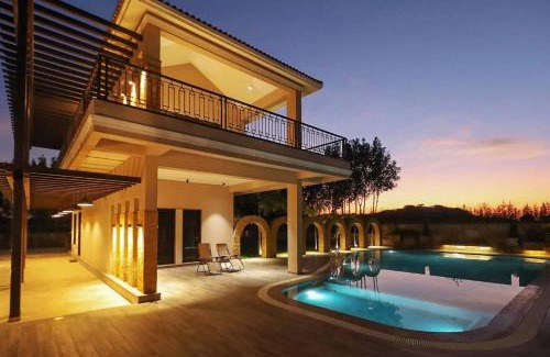Anjar Villa | Serene Desert Palms in Kutch: Pool & Scenic Balcony Retreat