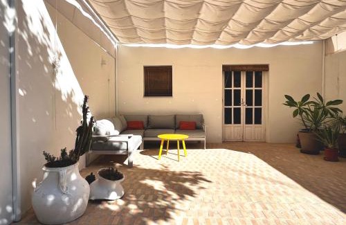 Carrion De Los Cespedes Apartment | Artistic Retreat with Patio & Orange Tree Near Seville